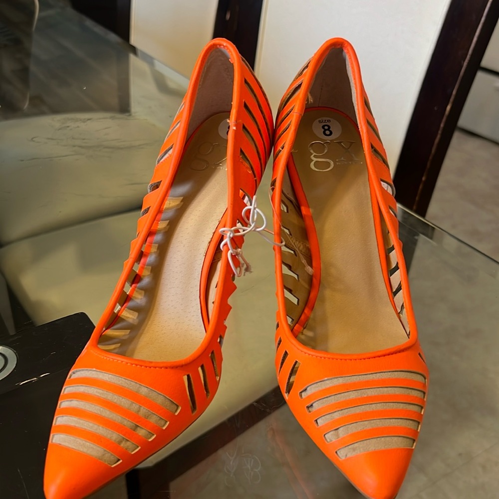 Bright orange pumps